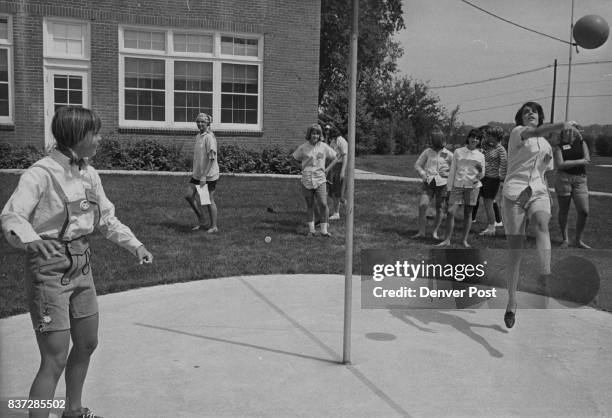 Kristi Powell of 714 Ivonhoe St., and Kathy Greco of 115 Ivy St., engage in a spirited tether- ball game on the grounds at St. Mary's Academy....