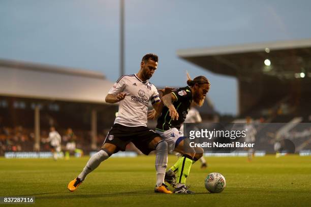 Stuart Sinclair of Bristol Rovers holds off Neeskens Kebano of Fulham during the Carabao Cup Second Round match between Fulham and Bristol Rovers at...
