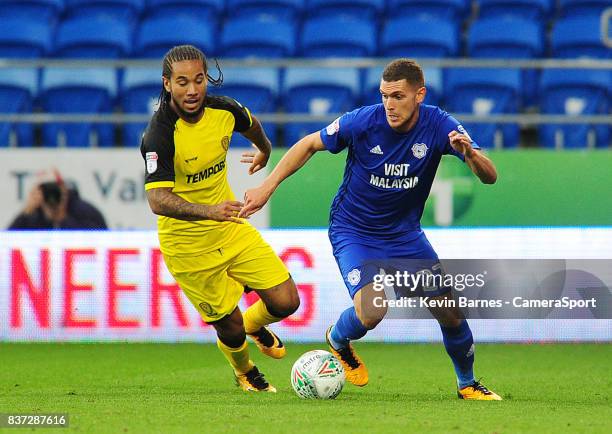 Cardiff City's Stuart O'Keefe under pressure from Burton Albion's Sean Scannell during the Carabao Cup Second Round match between Cardiff City and...