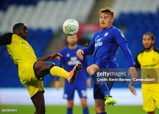Burton Albion's Lucas Akins vies for possession with Cardiff City's Danny Ward during the Carabao Cup Second Round match between Cardiff City and...