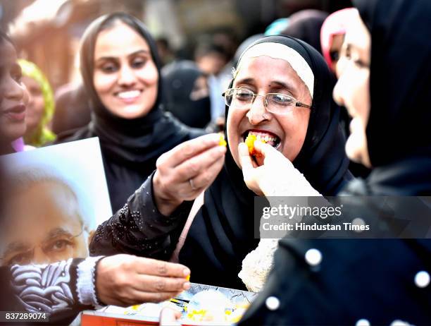 Ladies from Muslim community celebrate after verdict given by the Supreme Court for banning Triple Talaq at Byculla on August 22, 2017 in Mumbai,...