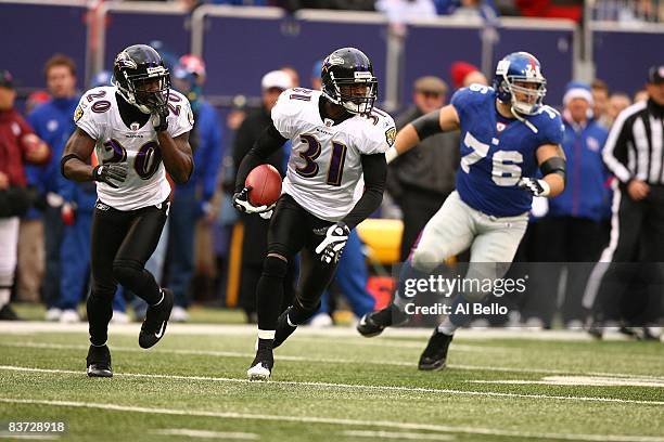 Fabian Washington of the Baltimore Ravens intercepts the ball against The New York Giants during their game on November 16, 2008 at Giants Stadium in...