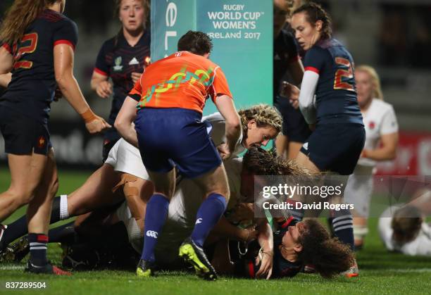 Sarah Bern of England crashes over the line to score the opening try during the Women's Rugby World Cup 2017 Semi Final match between England and...