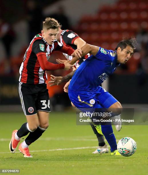 Sheffield United's David Brooks and Leicester City's Leonardo Ulloa battle for the ball during the Carabao Cup, Second Round match at Bramall Lane,...