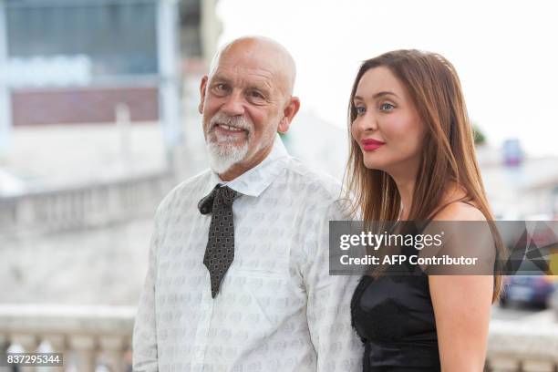 Actor and director John Malkovich, president of the jury, and Italian actress Isabella Orsini pose during a photocall at the 10th Angouleme...