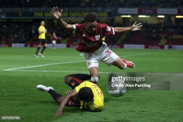Freddie Hinds of Bristol City tussles with Christian Kabasele of Watford during the Carabao Cup Second Round match between Watford and Bristol City...