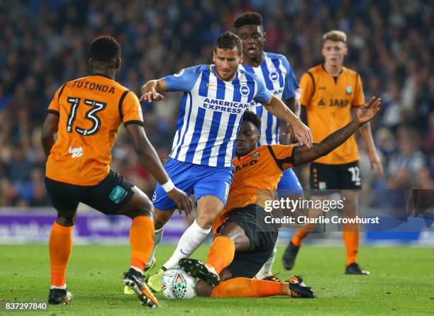 Ricardo Santos of Barnet tackles Tomer Hemed of Brighton and Hove Albion during the Carabao Cup Second Round match between Brighton & Hove Albion and...