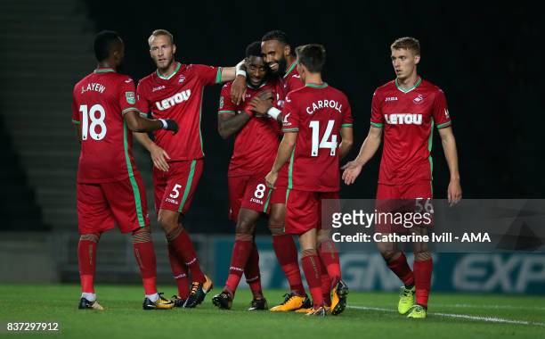 Leroy Fer of Swansea City celebrates with his team mates after scoring to make it 1-2 during the Carabao Cup Second Round match between Milton Keynes...