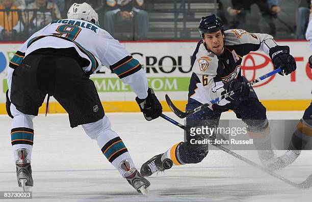 Shea Weber of the Nashville Predators shoots the puck by Milan Michalek of the San Jose Sharks at the Sommet Center on November 17, 2008 in...