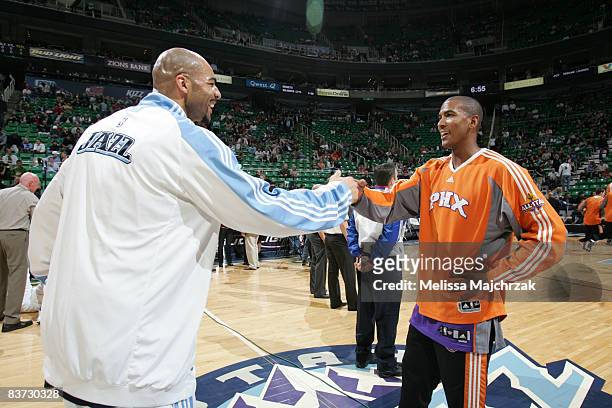 Carlos Boozer of the Utah Jazz greets Raja Bell of the Phoenix Suns at EnergySolutions Arena on November 17, 2008 in Salt Lake City, Utah. NOTE TO...
