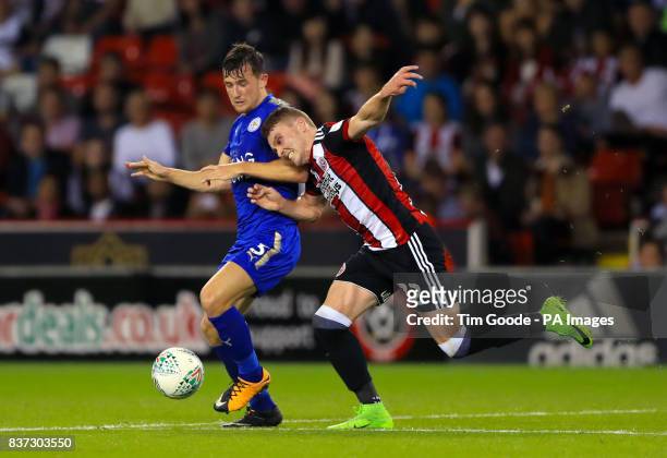 Leicester City's Ben Chillwell and Sheffield United's Caolan Lavery battle for the ball during the Carabao Cup, Second Round match at Bramall Lane,...