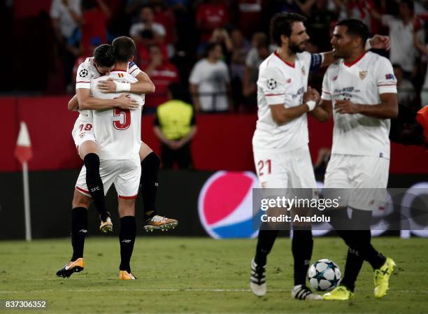 Sergio Escudero and Clement Lenglet of Sevilla celebrate after scoring a goal during the UEFA Champions League play-off match between Sevilla and...