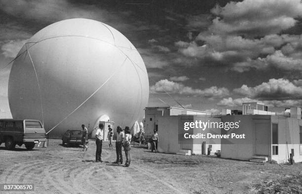 The dome can stand a 60-mile-on-hour wind. The trailer and buildings at the right contain the computers and operations center. Credit: Denver Post,...
