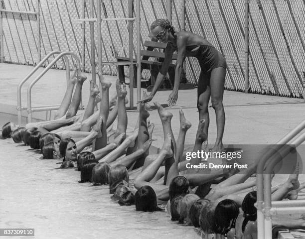 Performers polish the water show which will be presented by Synchronized Swimmers at Brighton's Municipal Pool on Skeel St. At 8 p.m. Aug. 9 and 10....