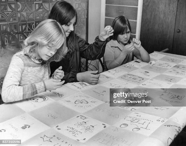One Hundred Square Quilt Symbolizes Colorado's Centennial Kathy Swanstrom , Pam Muniz and Betty O'Brien of Arvada Junior Girl Scout troop 578 work on...