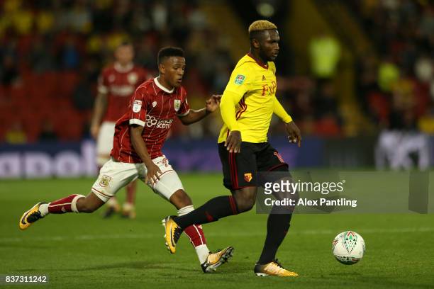 Isaac Success of Watford holds off Niclas Eliasson of Bristol City during the Carabao Cup Second Round match between Watford and Bristol City at...
