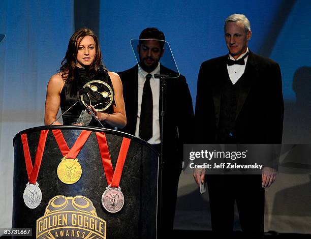 Rebecca Soni receives a Golden Goggles Award for breakout performer of the year from David Blaine and Jim Montgomery at the fifth annual USA Swimming...