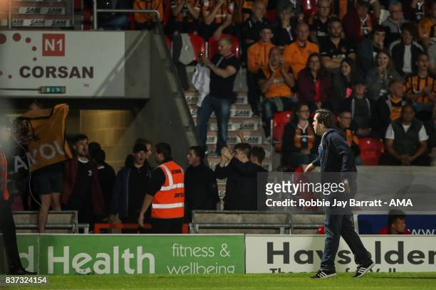 Fans of Hull City invade the pitch in protest during the Carabao Cup Second Round match between Doncaster Rovers and Hull City at Keepmoat Stadium on...