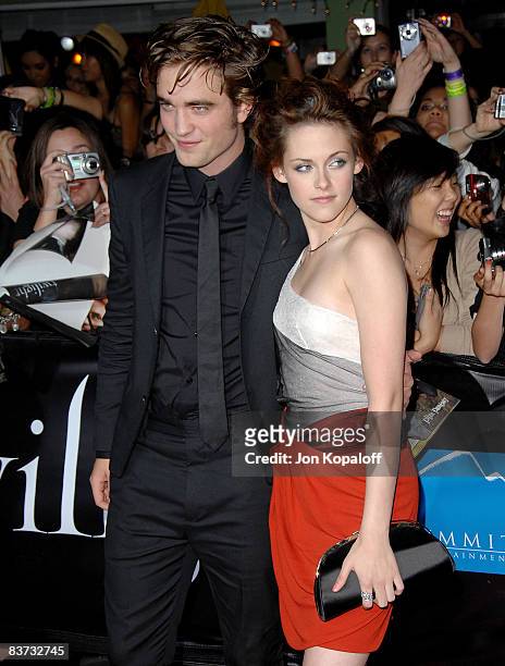 Actor Robert Pattinson and actress Kristen Stewart arrive at the Los Angeles Premiere "Twilight" at the Mann Village Theater on November 17, 2008 in...