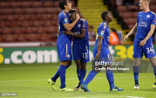 Ahmed Musa of Leicester City celebrates with Leonardo Ulloa of Leicester City after scoring to make it 1-4 during the Carabao Cup Second Round tie...