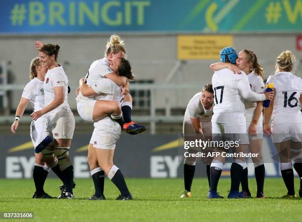 England players celebrate victory after the Women's Rugby World Cup 2017 semi-final match between England and France at The Kingspan Stadium in...