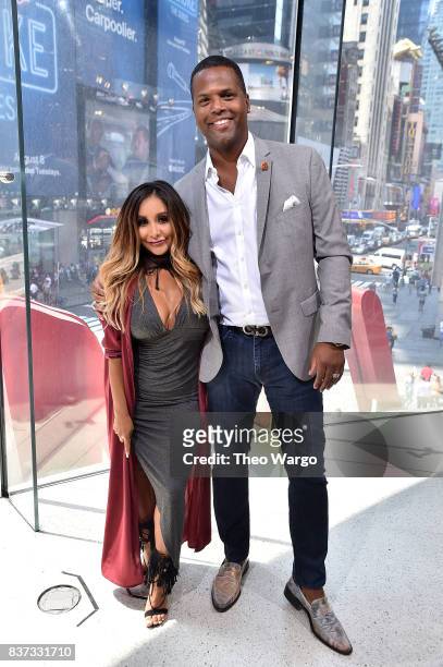 Nicole "Snooki" Polizzi and AJ Calloway during a taping of "Extra" at H&M Times Square on August 22, 2017 in New York City.