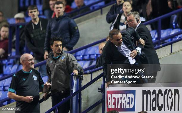 Sheffield Wednesday manager Carlos Carvalhal reacts angrily with stewards after being sent to the stands by referee David Webb during the Carabao Cup...