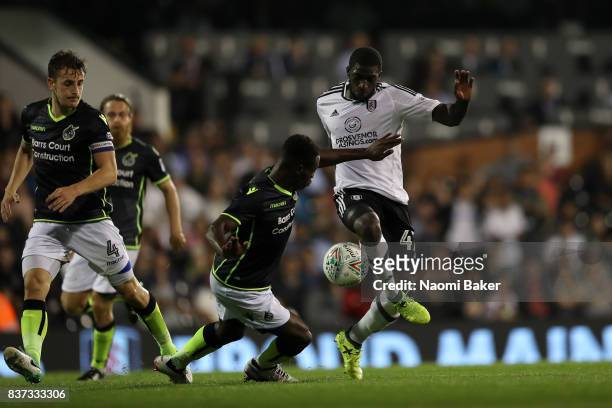 Aboubakar Kamara of Fulham takes on Marc Bola of Bristol Rovers during the Carabao Cup Second Round match between Fulham and Bristol Rovers at Craven...