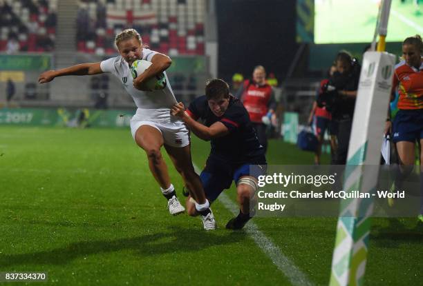 Kay Wilson of England is denied a try by Audrey Forlani of France during the Womens Rugby World Cup semi-final between England and France at the...