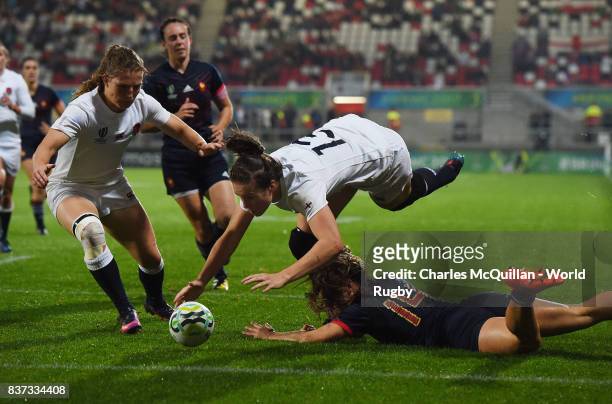 Emily Scarratt of England is denied a try by Elodie Guiglion of France during the Womens Rugby World Cup semi-final between England and France at the...
