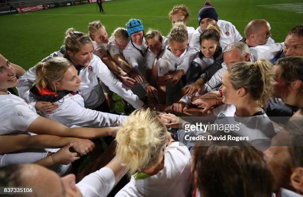 England players and coaching staff celebrate following their team's 20-3 victory during the Women's Rugby World Cup 2017 Semi Final match between...