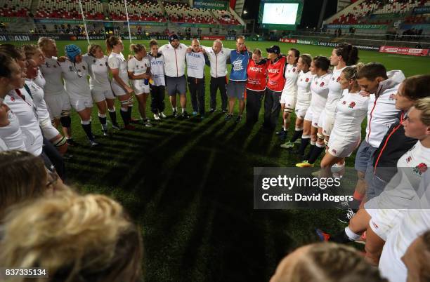 England players and coaching staff celebrate following their team's 20-3 victory during the Women's Rugby World Cup 2017 Semi Final match between...