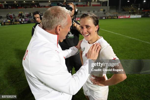 Simon Middleton the head coach of England and Katy Mclean of England celebrate following their team's 20-3 victory during the Women's Rugby World Cup...