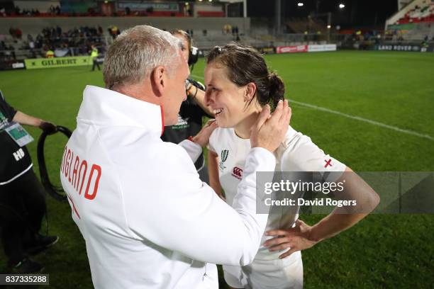 Simon Middleton the head coach of England and Katy Mclean of England celebrate following their team's 20-3 victory during the Women's Rugby World Cup...