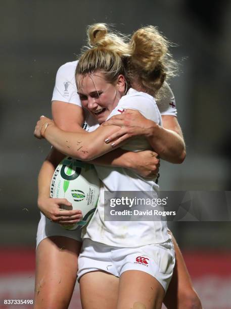 Megan Jones of England celebrates with teammate Amber Reed after scoring her team's second try during the Women's Rugby World Cup 2017 Semi Final...