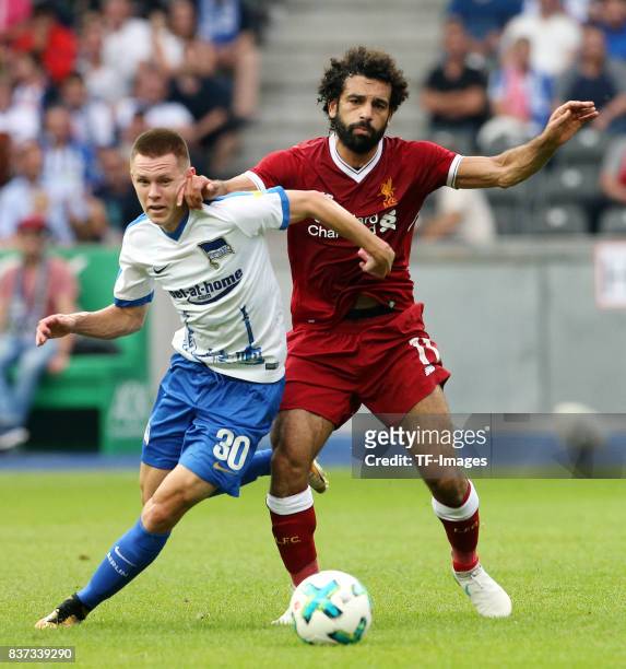 Julius Kade of Hertha and Mohamed Salah of Liverpool battle for the ball during the Preseason Friendly match between Hertha BSC and FC Liverpool at...