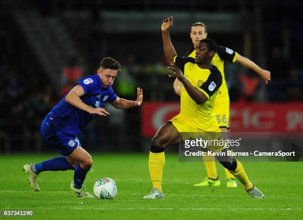 Cardiff City's Cameron Coxe under pressure from Burton Albion's Marvin Sordell during the Carabao Cup Second Round match between Cardiff City and...