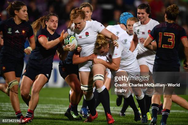Harriet Millar-Mills of England charges through the France defence during the Womens Rugby World Cup semi-final between England and France at the...