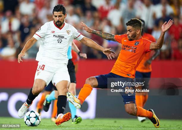 Manuel Agudo "Nolito" of Sevilla FC competes for the ball with Junior Caicara of Istanbul Basaksehir during the UEFA Champions League Qualifying...