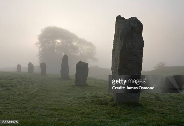 neolithic stone circle in fog at avebury,  - stone circle stock pictures, royalty-free photos & images