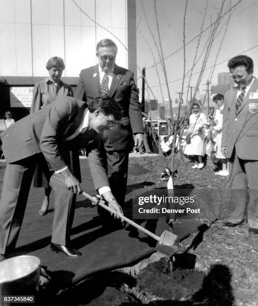 Nichiren Shoshu Soka Gakkai of America 1450 Speer blvd. NSA Denver culture center "100 cherry tress to be presented to the city Pouring water into...