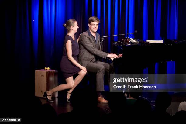German singer Melanie Haupt and Bodo Wartke perform live on stage during a concert at the BKA Theater on August 22, 2017 in Berlin, Germany.
