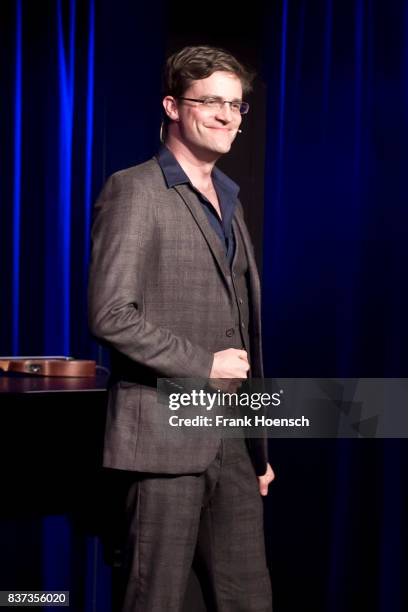 German singer and comedian Bodo Wartke performs live on stage during a concert at the BKA Theater on August 22, 2017 in Berlin, Germany.