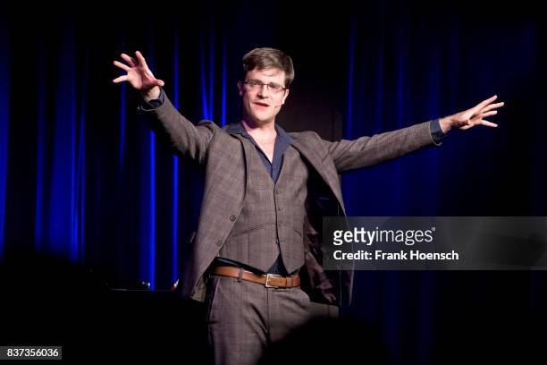 German singer and comedian Bodo Wartke performs live on stage during a concert at the BKA Theater on August 22, 2017 in Berlin, Germany.