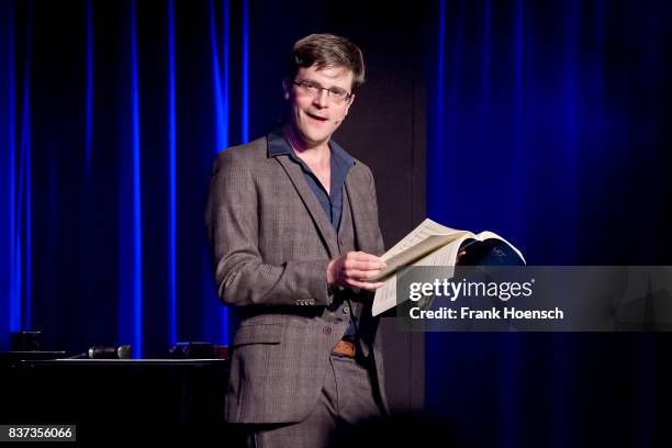 German singer and comedian Bodo Wartke performs live on stage during a concert at the BKA Theater on August 22, 2017 in Berlin, Germany.