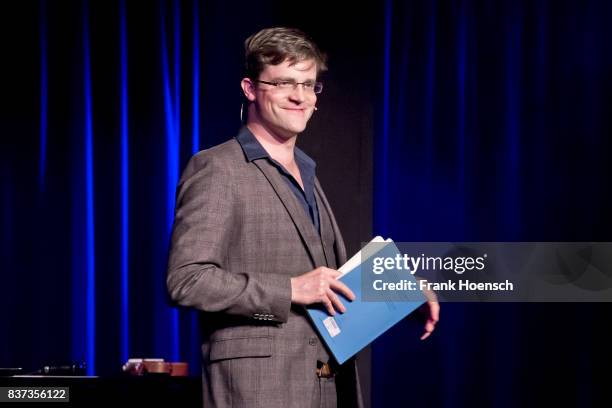 German singer and comedian Bodo Wartke performs live on stage during a concert at the BKA Theater on August 22, 2017 in Berlin, Germany.