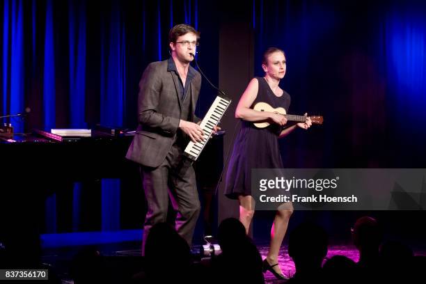 German singer Bodo Wartke and Melanie Haupt perform live on stage during a concert at the BKA Theater on August 22, 2017 in Berlin, Germany.