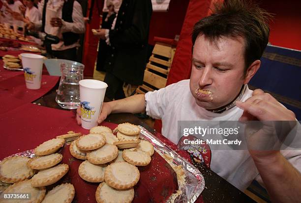 Competitor eats his way through pies during the Wookey Hole Big Eat 2008, the annual mince pie eating contest, at the Wookey Hole Show Caves on...