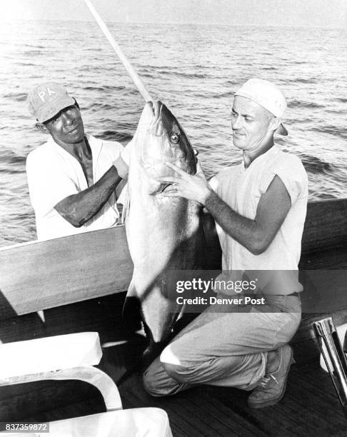 And at right Queal is pictured with 35 - pound amberjack. Wahoo, corvina, rooster fish also are plentiful at Pinas bay. Credit: Denver Post