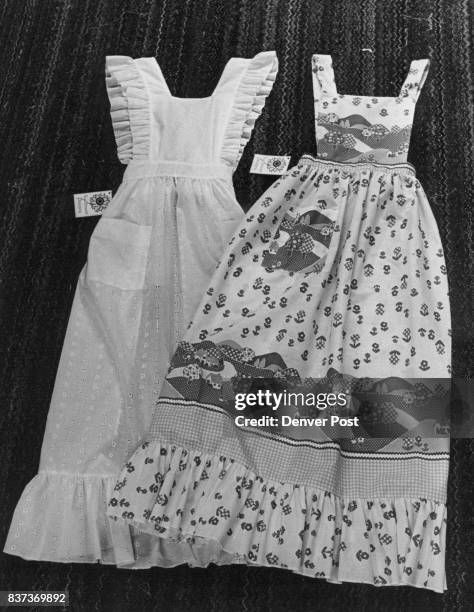 Aprons Pretty Enough For A Hoedown The designs from Beverly Lerner's Lakewood basement include, left, a be-ruffled white eyelet apron and one with a...